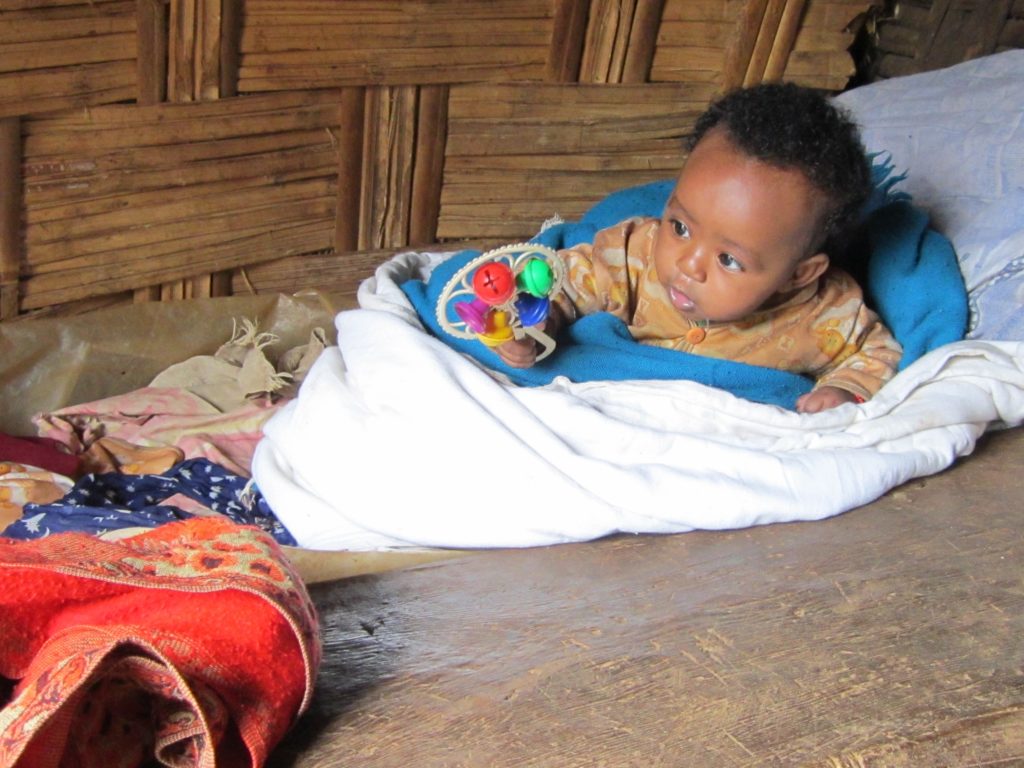 Ethiopia Baby playing with toy